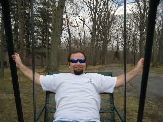 Me on some old glider swings at the park with Lisa